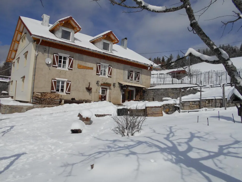 Maison sous la neige