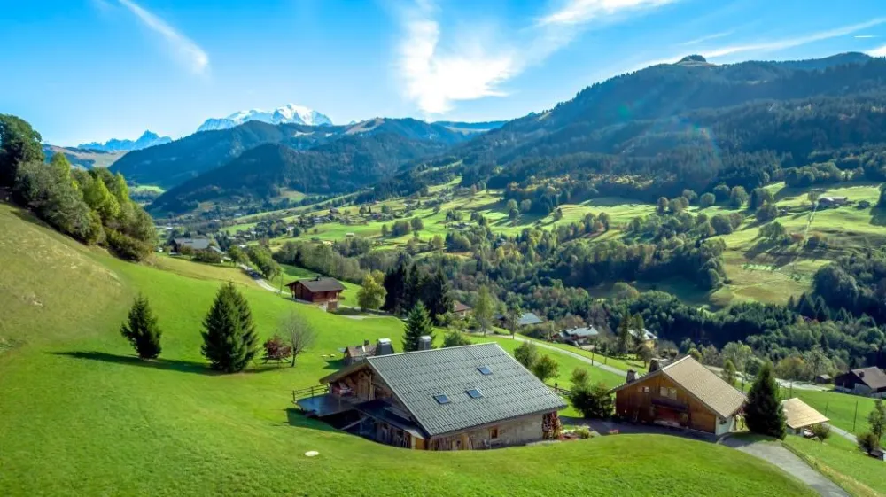 view from the Arly's valley with resorts of Praz sur Arly and Megève under the top of Mont-Blanc